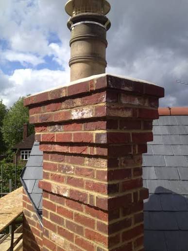 Rebuilt brick chimney with new pot and lead flashing in Manchester